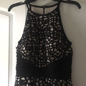 Black over nude cocktail dress